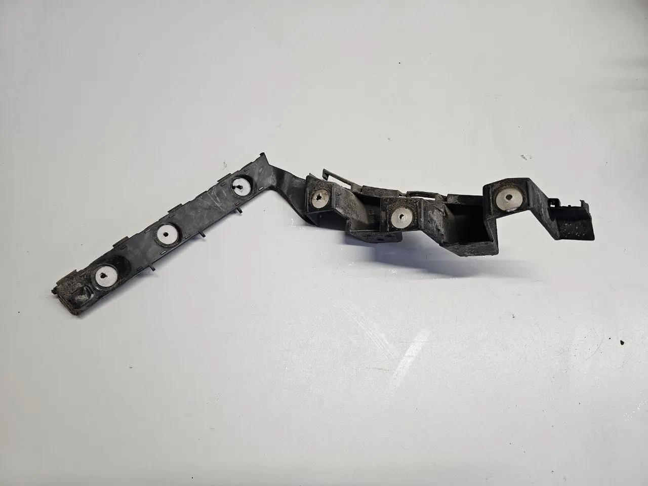 Halter Traeger Fuehrungsschiene Stoßstange Opel Corsa D 1.2L 2008 13179904